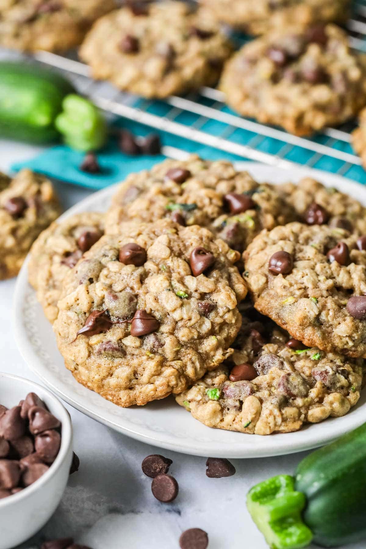 Cookies made with oatmeal, chocolate chips, and zucchini on a white plate.