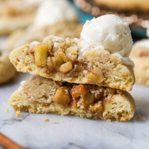 Two halves of an apple pie cookie stacked on top of each other.
