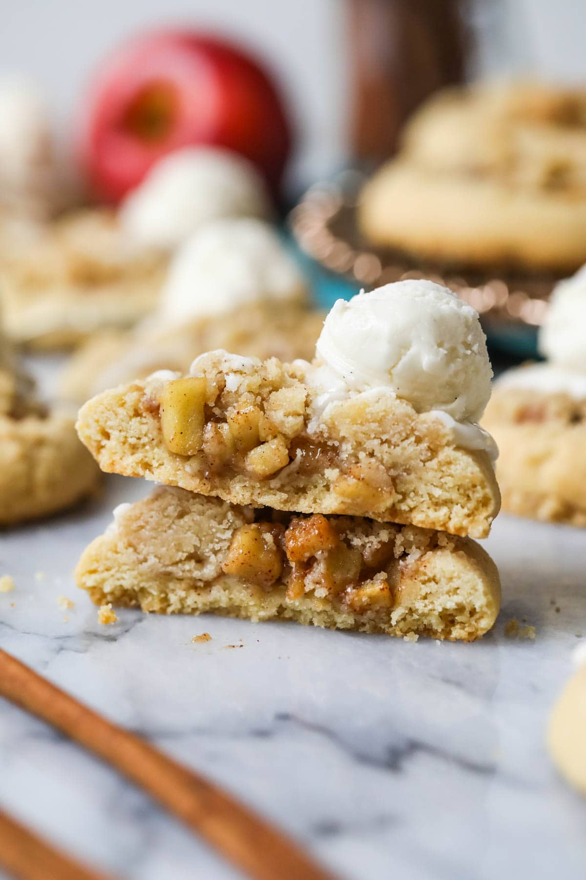 Two halves of an apple pie cookie stacked on top of each other.