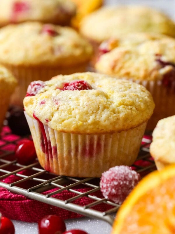Cranberry orange muffins on a cooling rack.