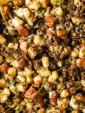 Close-up view of sausage stuffing in a casserole dish.