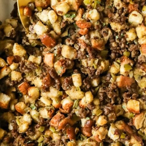 Close-up view of sausage stuffing in a casserole dish.