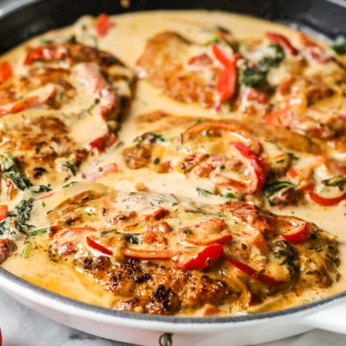 Tuscan chicken in a cast iron skillet.