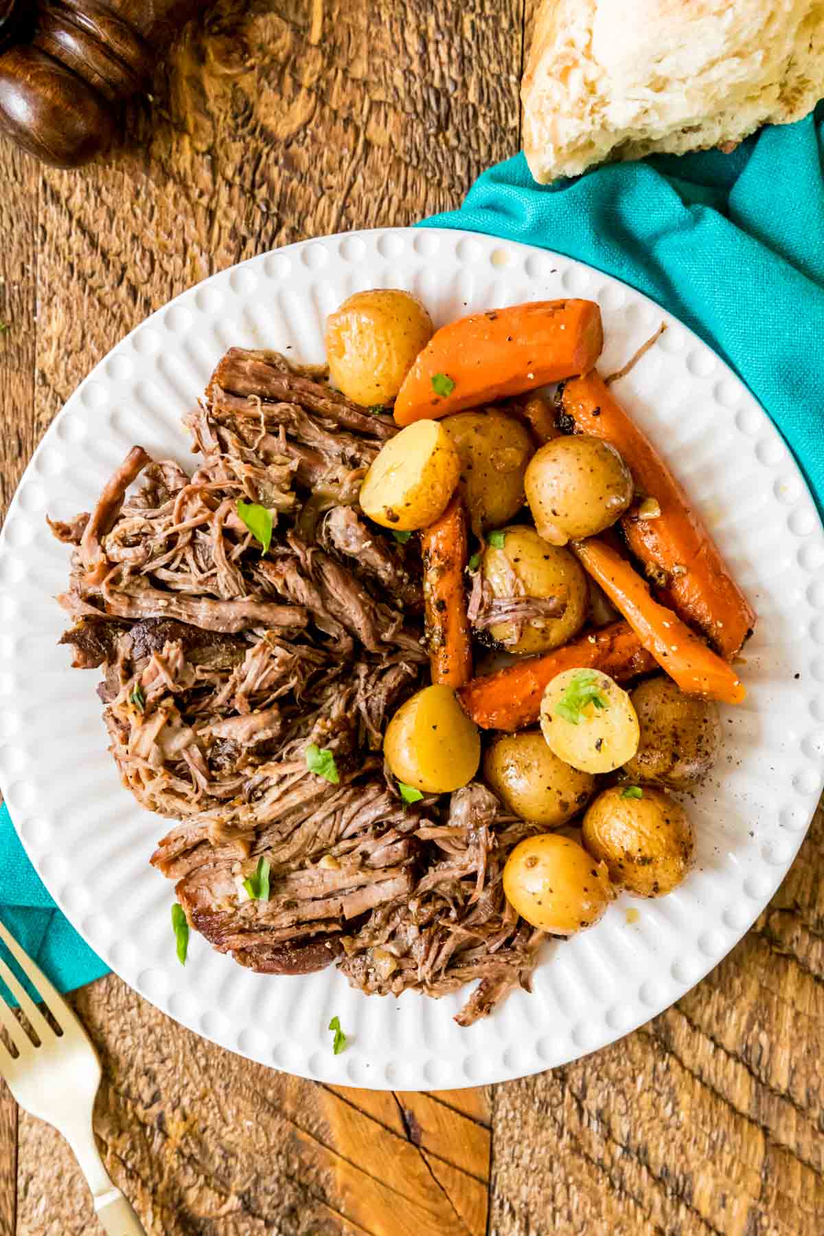 Bowl of shredded beef, carrots, and baby potatoes.