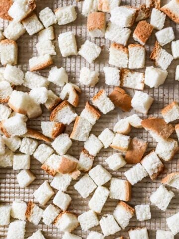 Overhead view of perfectly cut homemade bread cubes for stuffing.