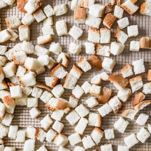 Overhead view of perfectly cut homemade bread cubes for stuffing.