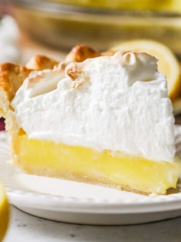 slice of lemon meringue pie on plate