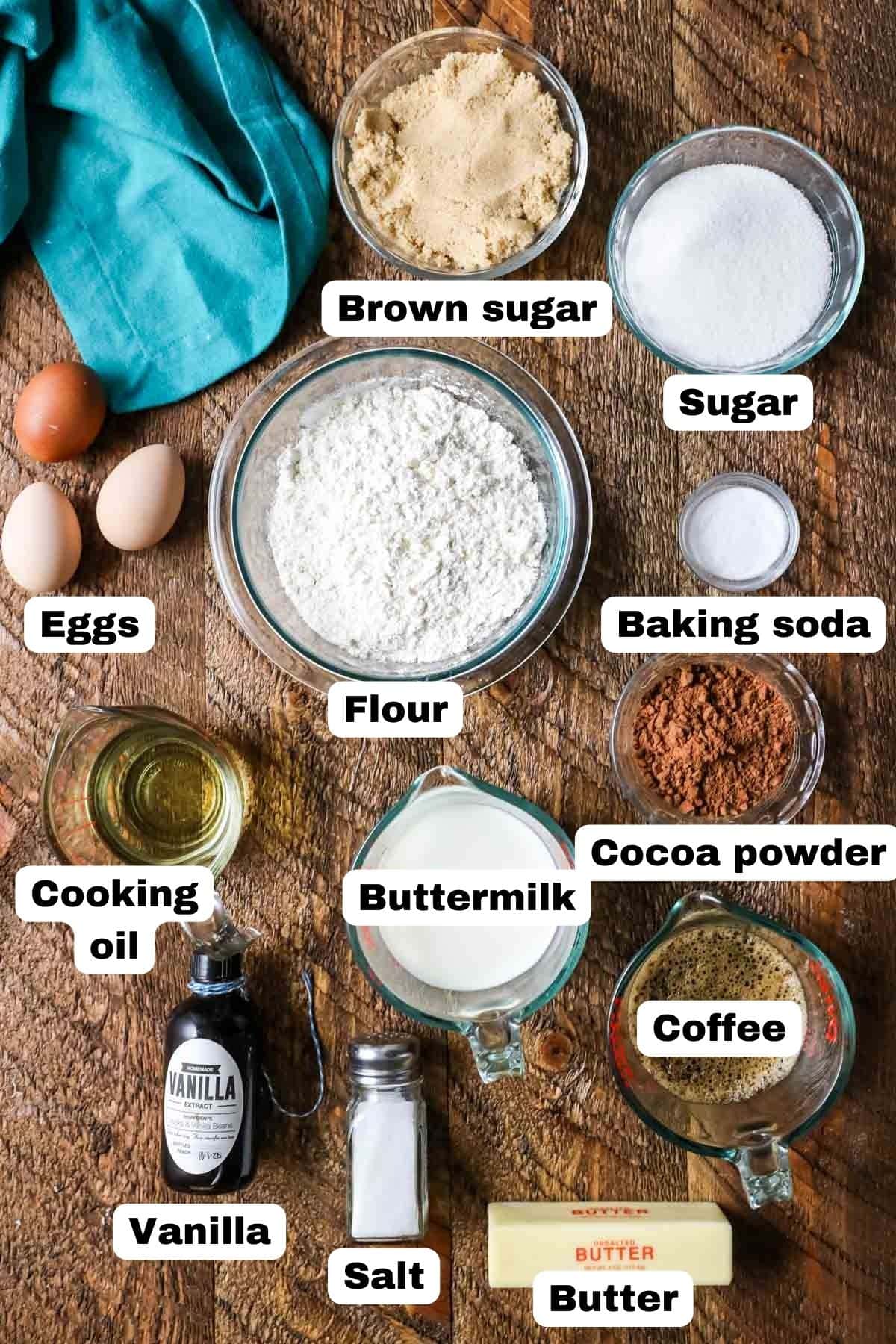 Overhead view of labelled ingredients including cocoa powder, buttermilk, coffee, and more.
