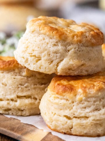 Three sourdough biscuits stacked on top of each other.