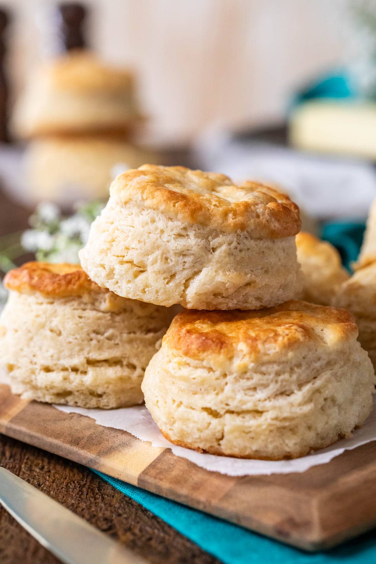 Three sourdough biscuits stacked on top of each other. 
