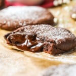 Chocolate lava cookie that's been bitten to show the molten chocolate center.