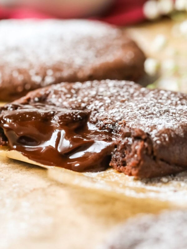 Chocolate lava cookie that's been bitten to show the molten chocolate center.