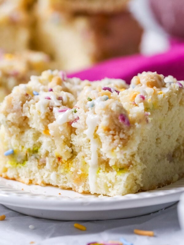 Slice of birthday crumb cake on a plate.