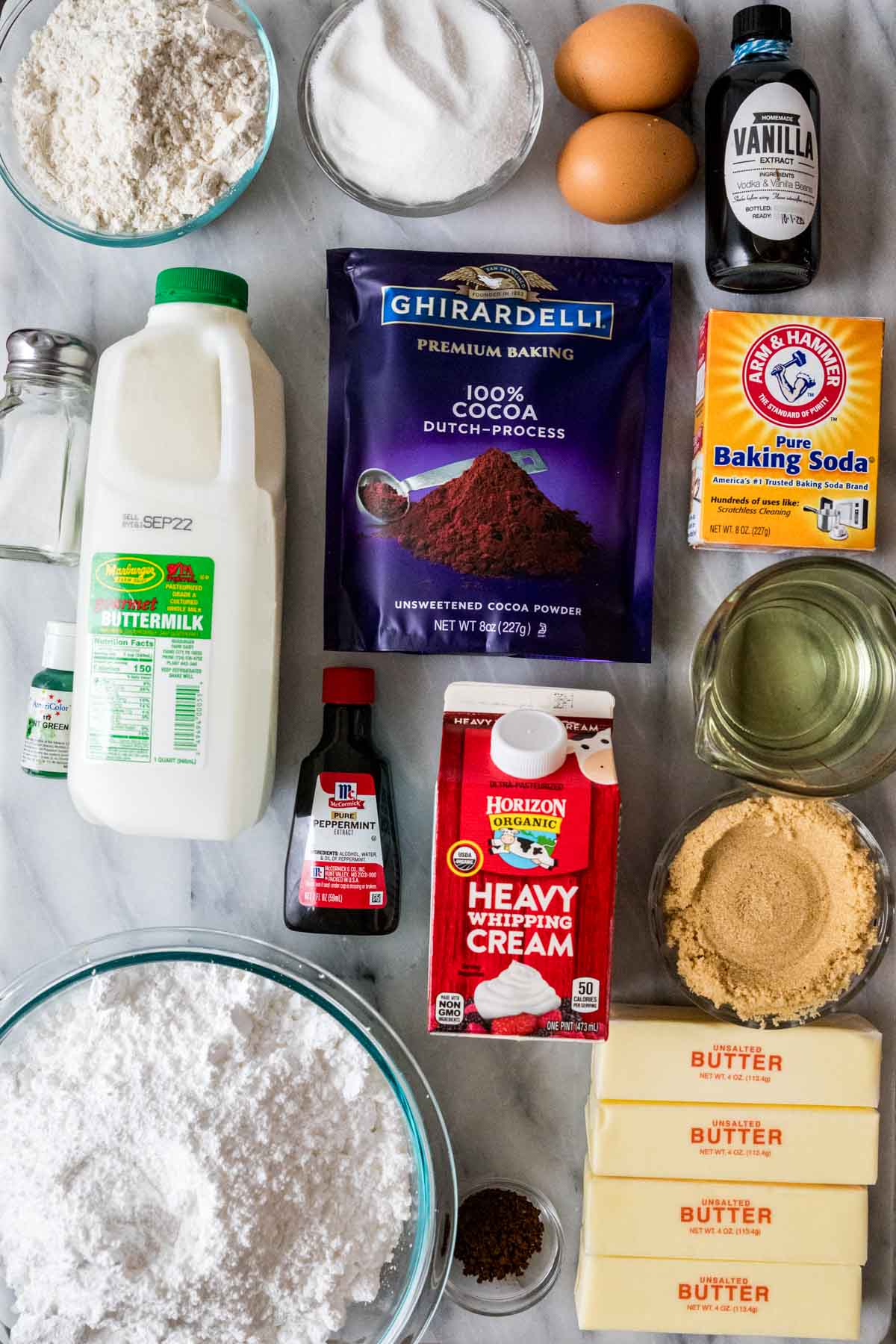 Overhead view of ingredients including cocoa powder, buttermilk, peppermint extract, and more.