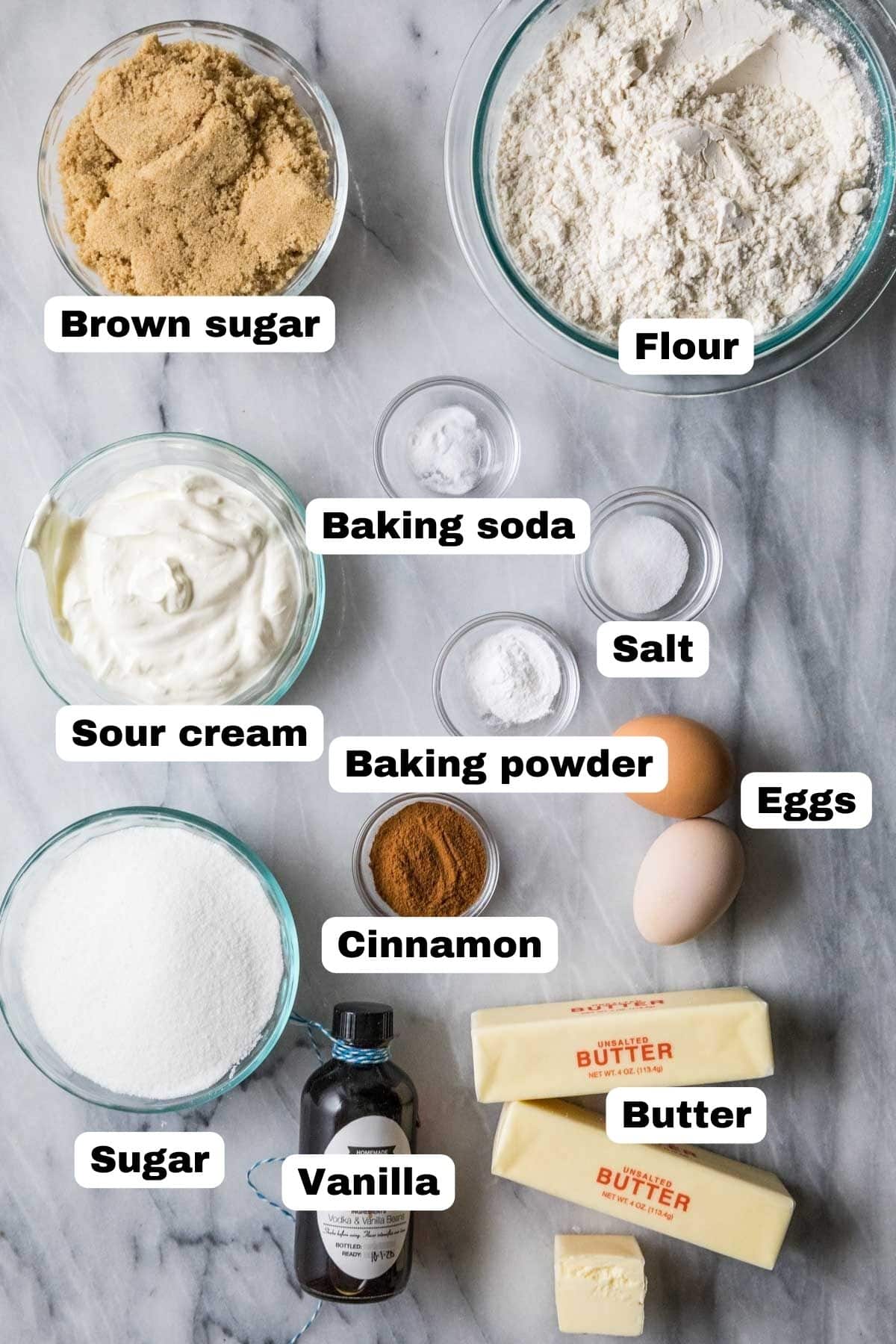 Overhead view of labelled ingredients including brown sugar, cinnamon, sour cream, and more.