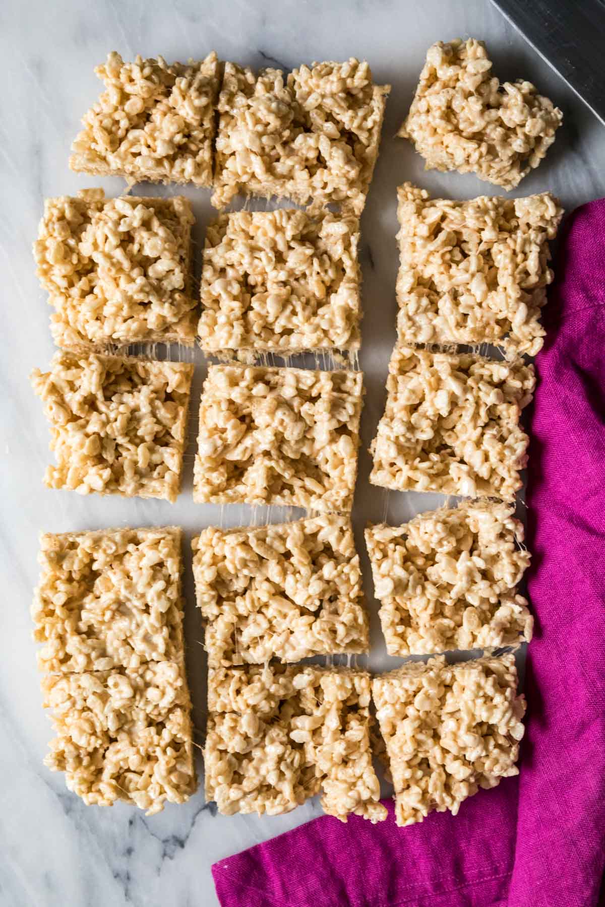 Overhead view of brown butter rice krispie treats that have been cut into squares.
