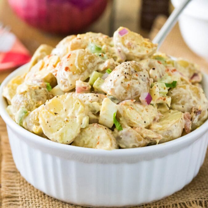 Large serving bowl of potato salad.