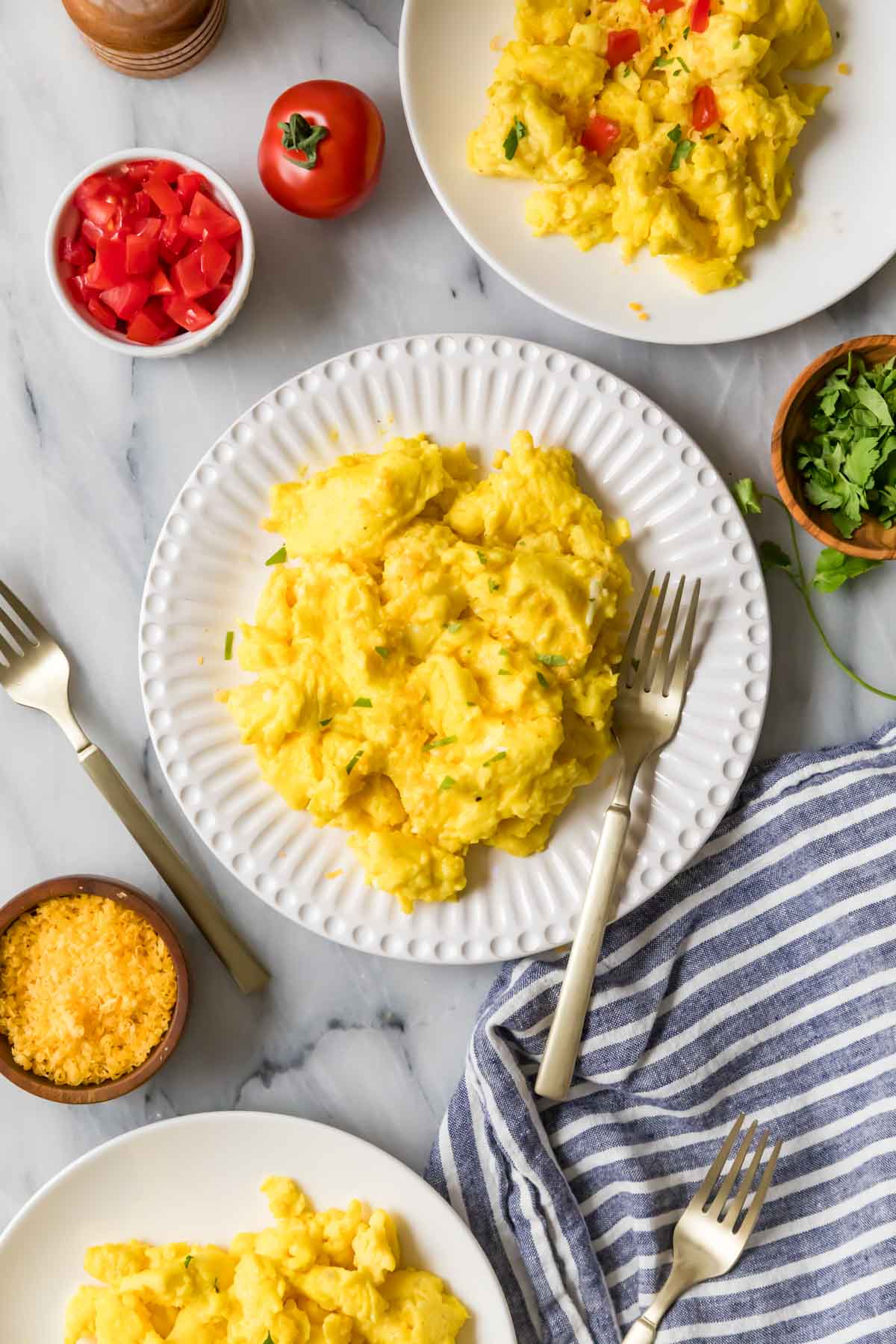 Overhead view of a plate of scrambled eggs.