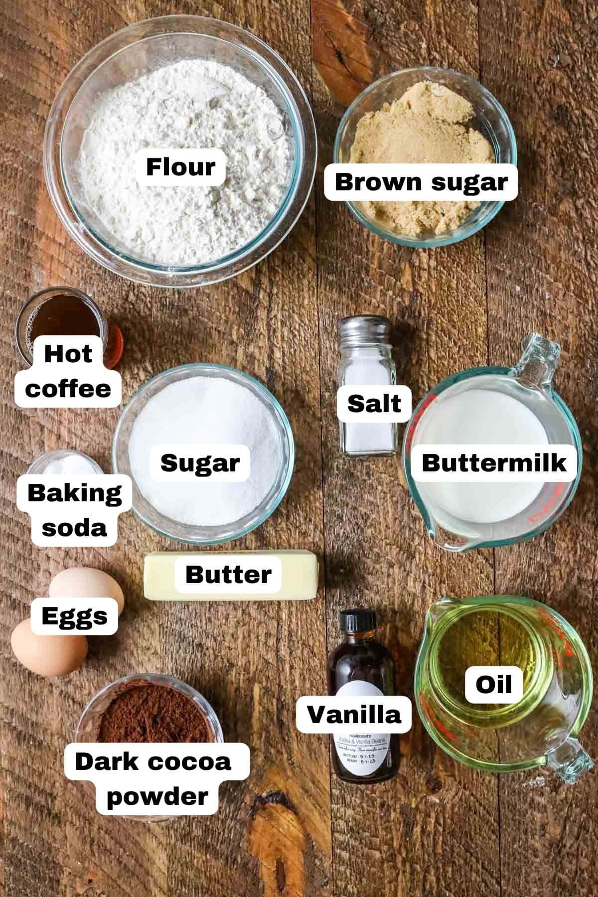 Overhead view of labelled ingredients including cocoa powder, brown sugar, coffee, and more.