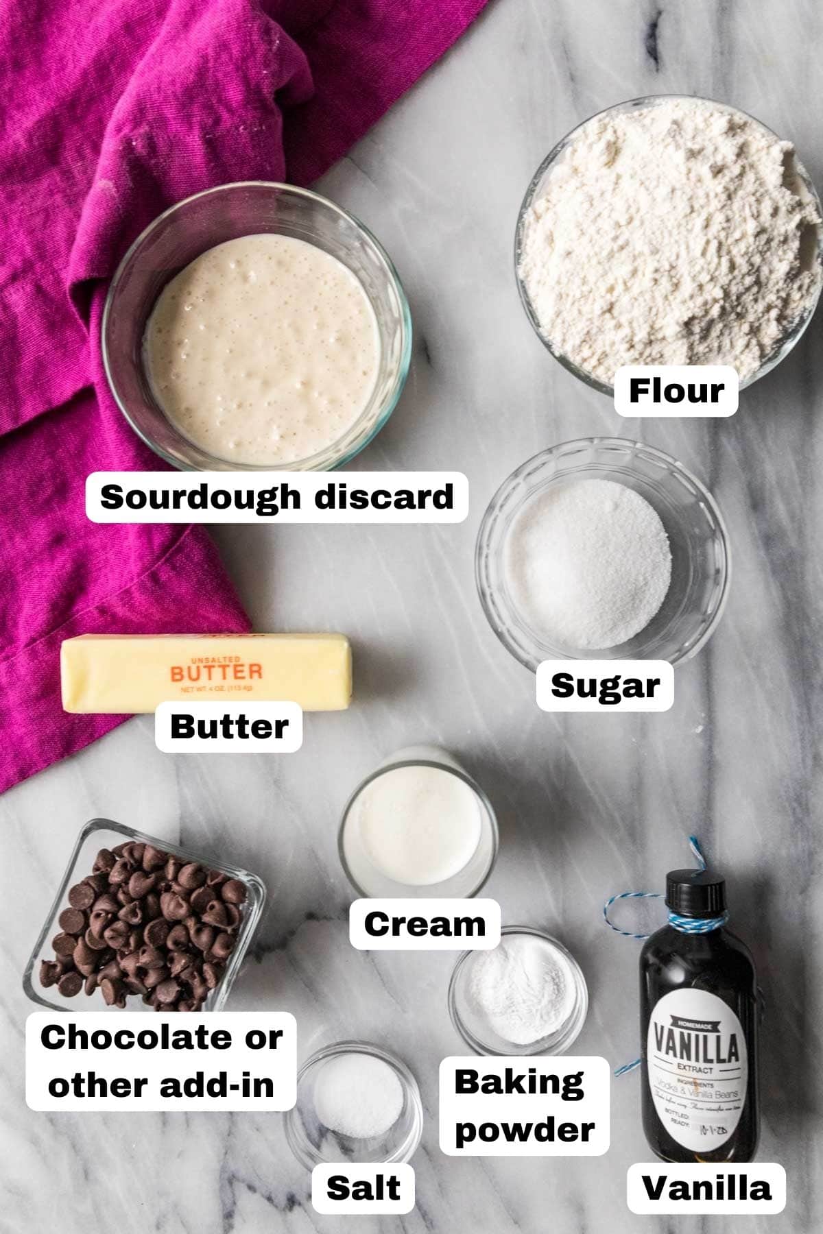 Overhead view of labelled ingredients including sourdough discard, chocolate chips, flour, and more.