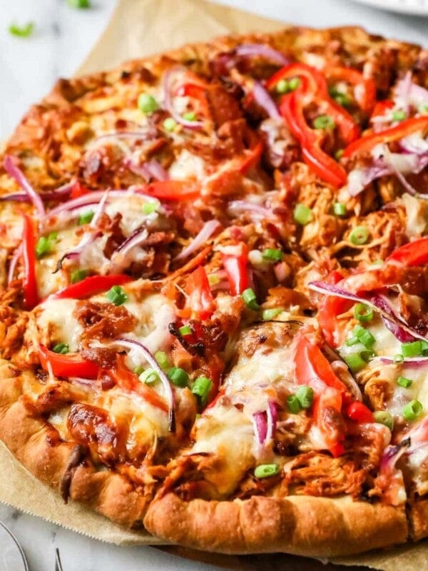 BBQ chicken pizza topped with red onion, bell pepper, and more.