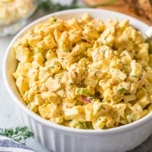 Egg salad in a white serving dish.