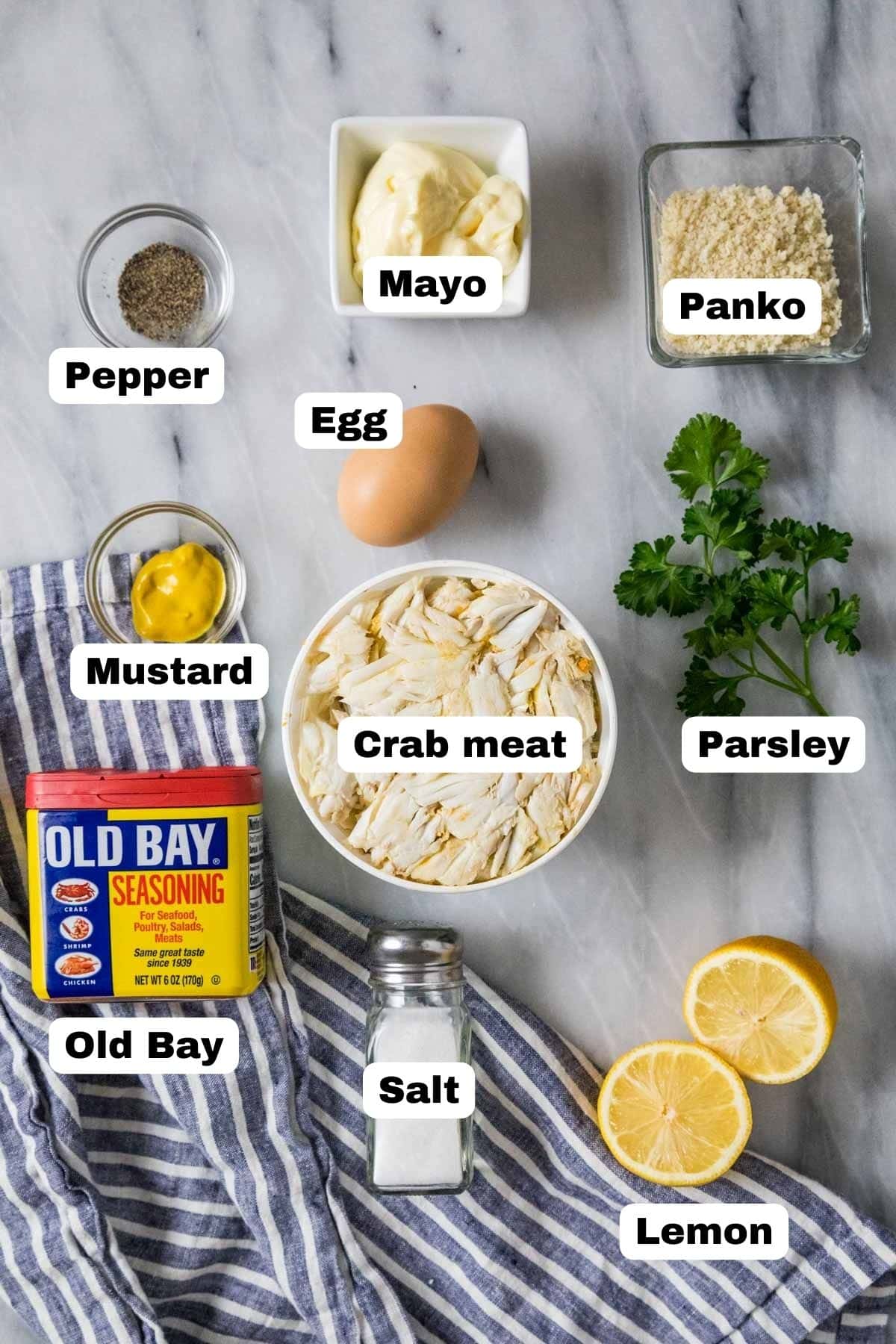 Overhead view of labelled ingredients including crab meat, mayo, panko, and more.