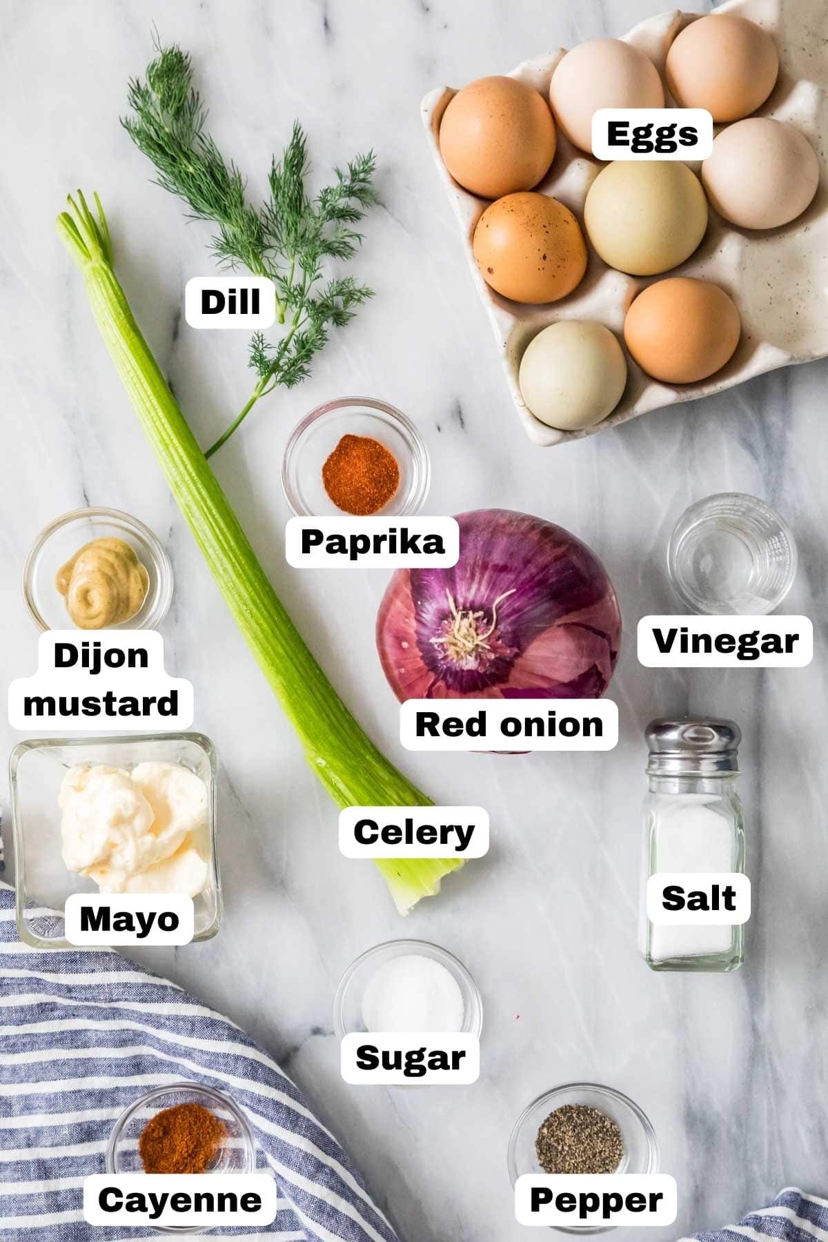 Overhead view of labelled ingredients including eggs, celery, mayo, and more.