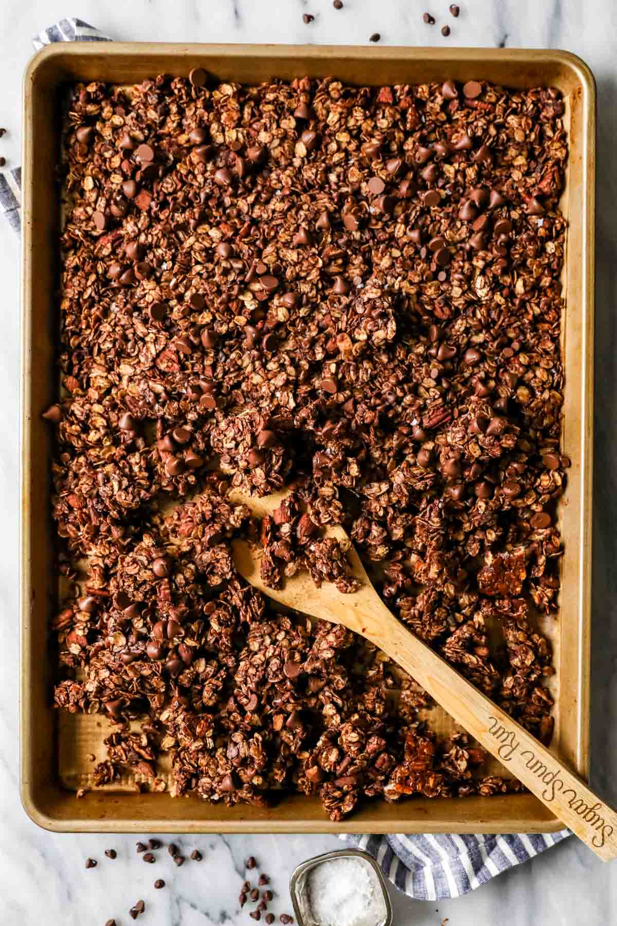 Chocolate granola on a baking sheet.