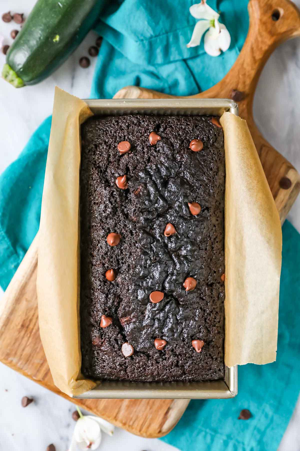 Overhead view of a chocolate zucchini bread in a pan.