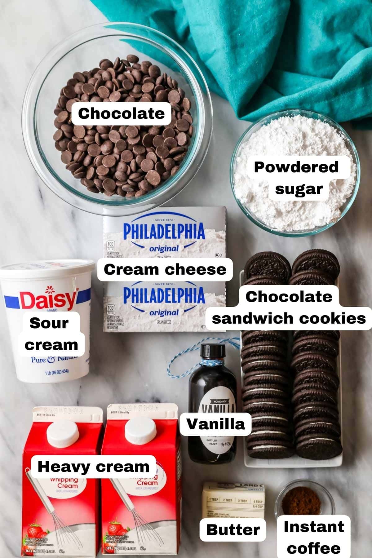 Overhead view of labelled ingredients including heavy cream, cream cheese, chocolate, and more.