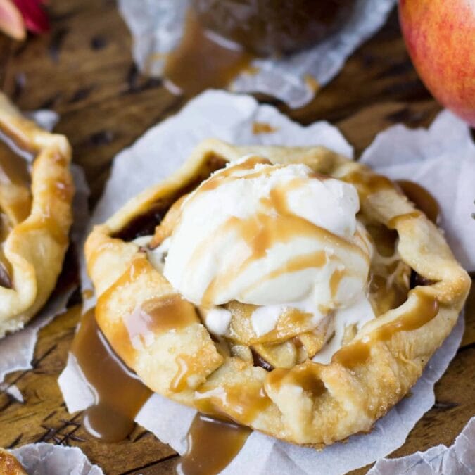 Caramel apple galette topped with vanilla ice cream.