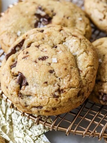 Close-up view of brown butter and bourbon cookies on a metal cooling rack.