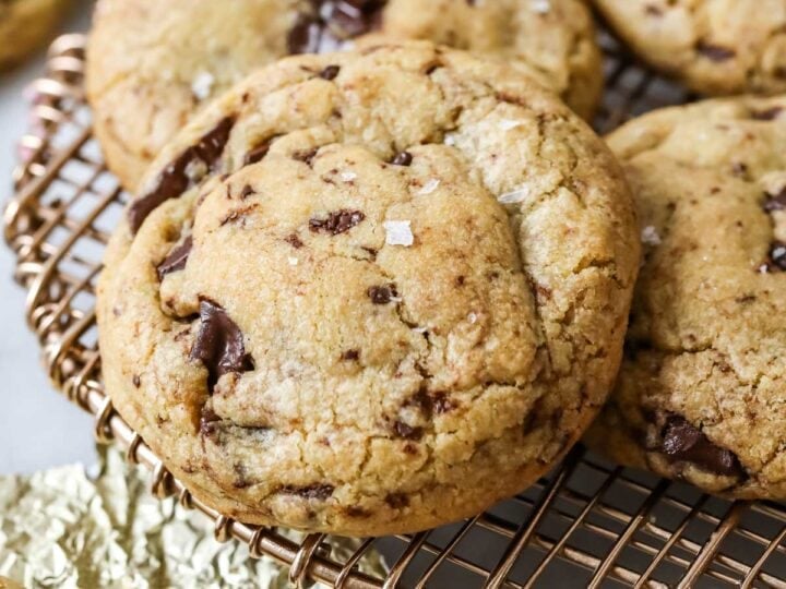 Close-up view of brown butter and bourbon cookies on a metal cooling rack.