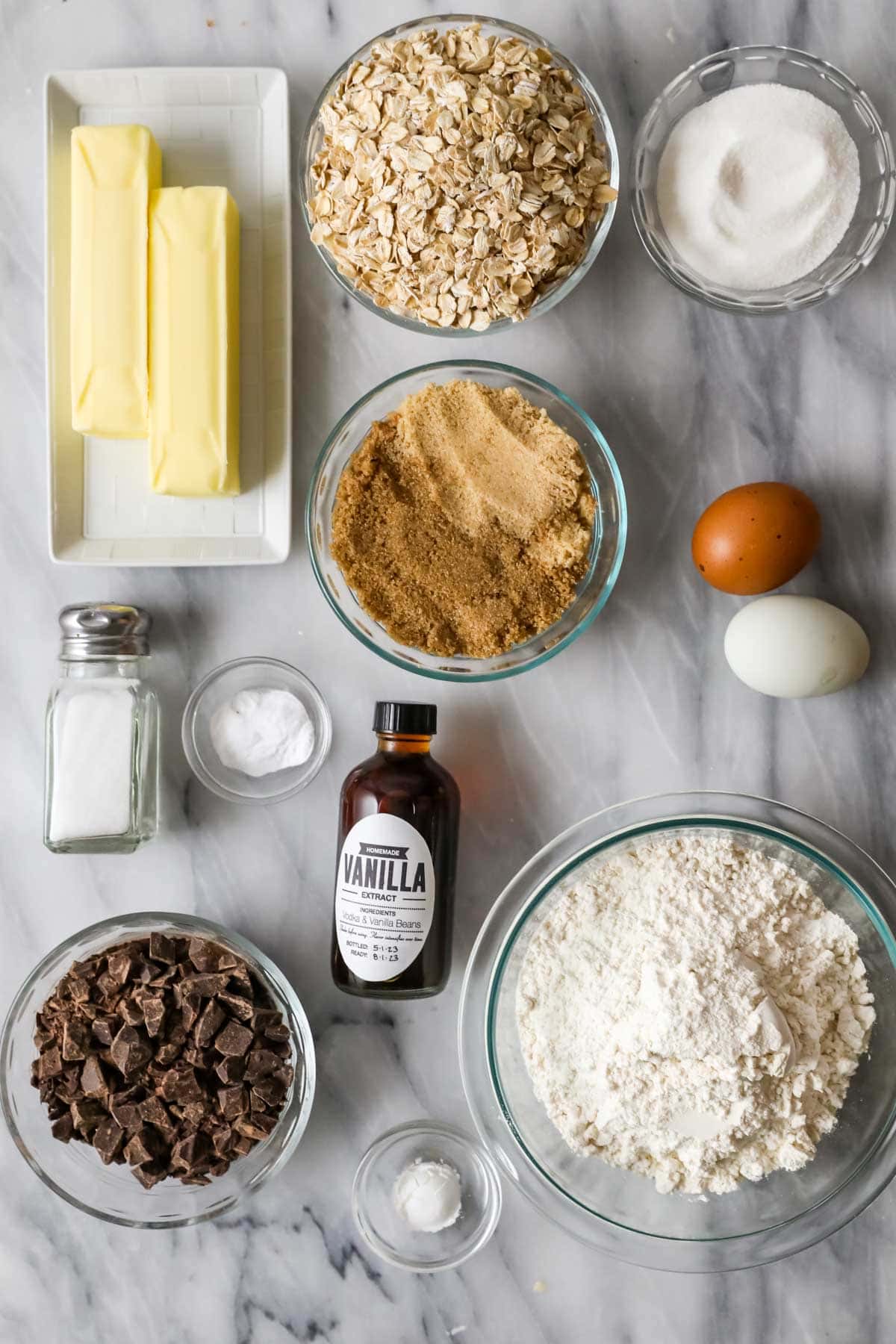 Overhead view of ingredients including oats, brown sugar, butter, and more.