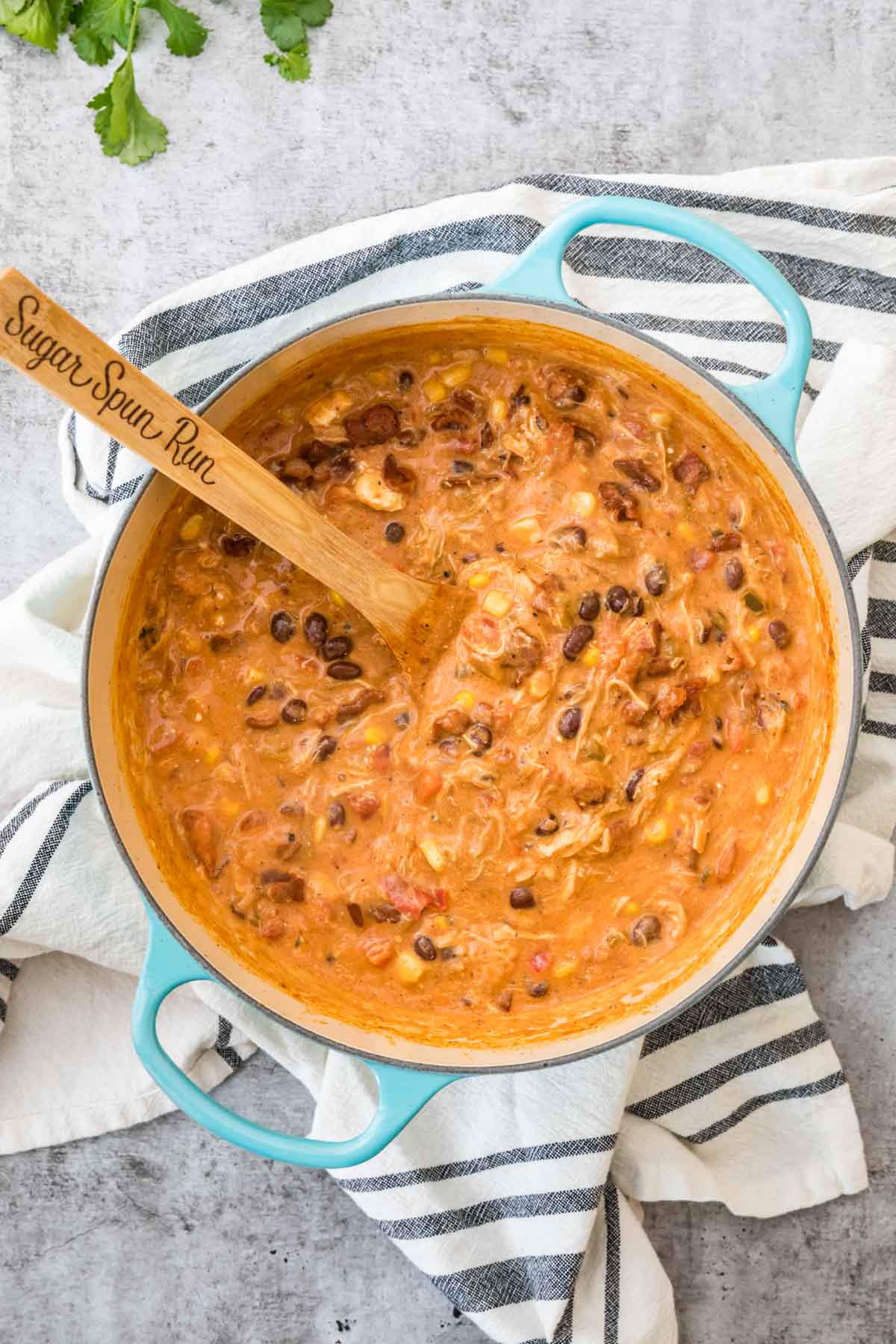 Overhead view of a pot of chicken tortilla soup.