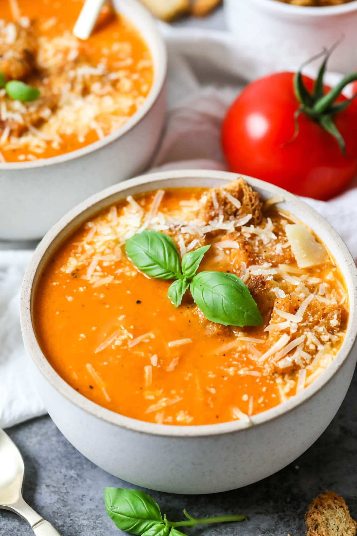 Bowl of soup made with fresh roasted tomatoes and basil.