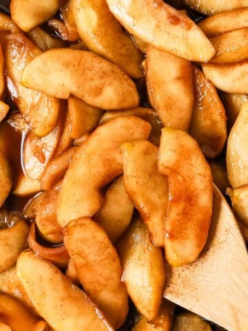 Overhead view of fried apples in a skillet.