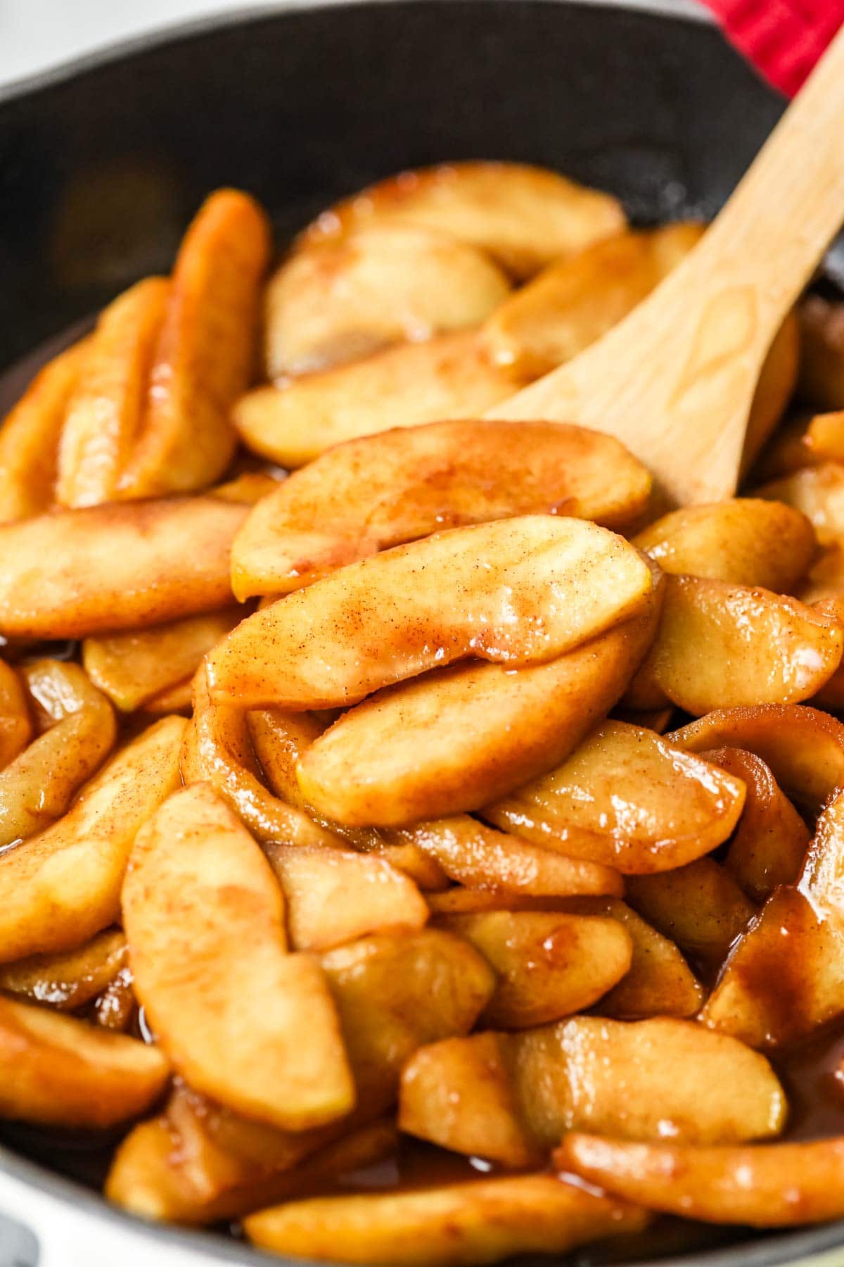 Close-up of apples fried in butter and spices.