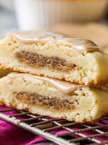 Two halves of a brown sugar cinnamon pop tart cookie stacked on top of each other.