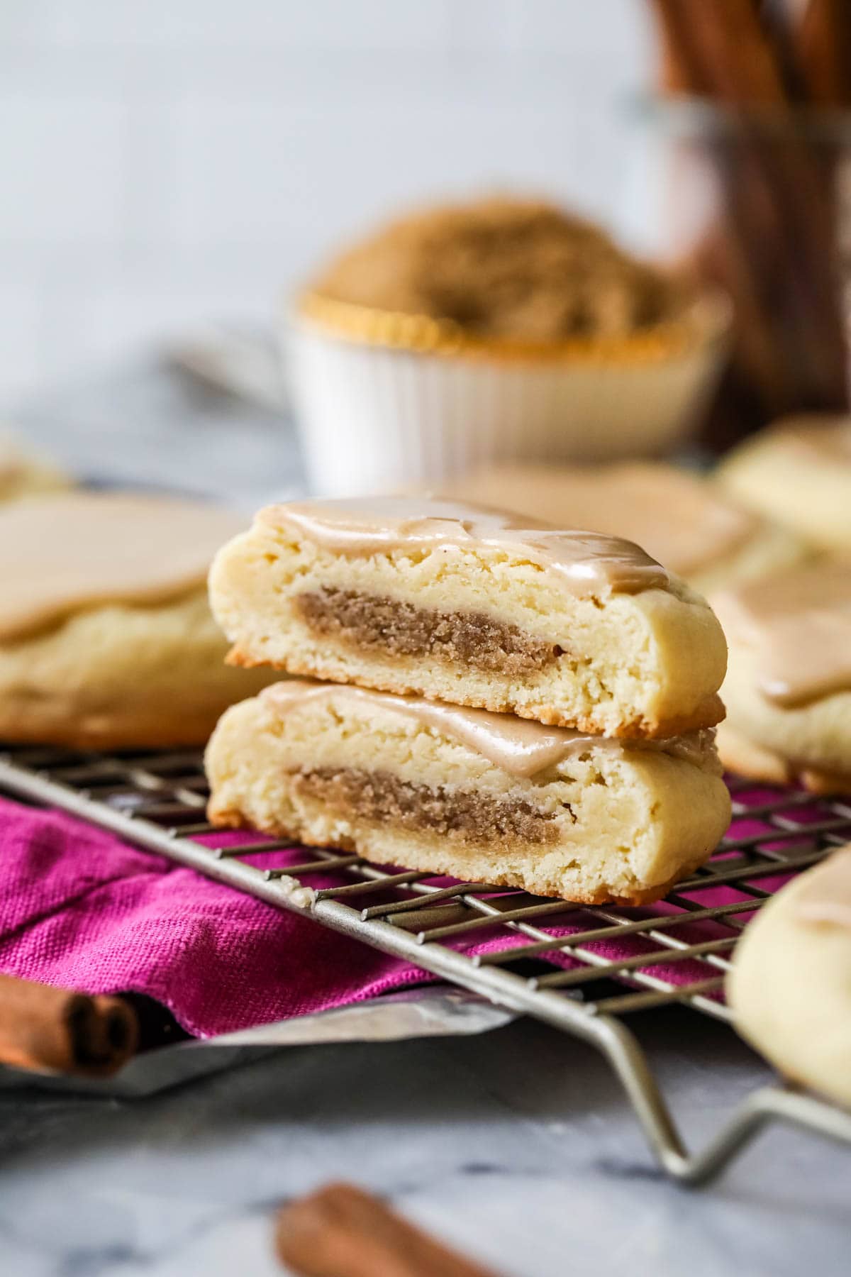 Two halves of a brown sugar cinnamon pop tart cookie stacked on top of each other. 