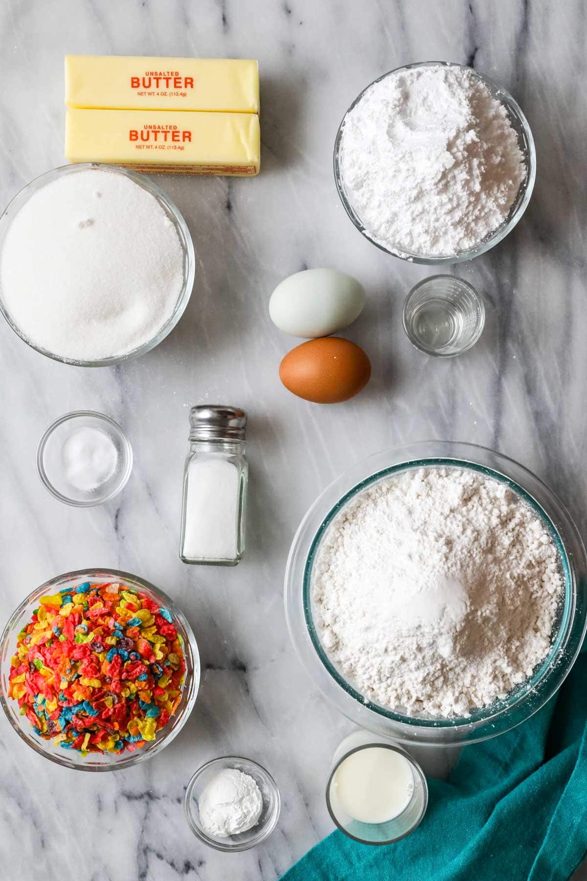 Overhead view of ingredients including Fruity Pebbles, butter, cake flour, and more.