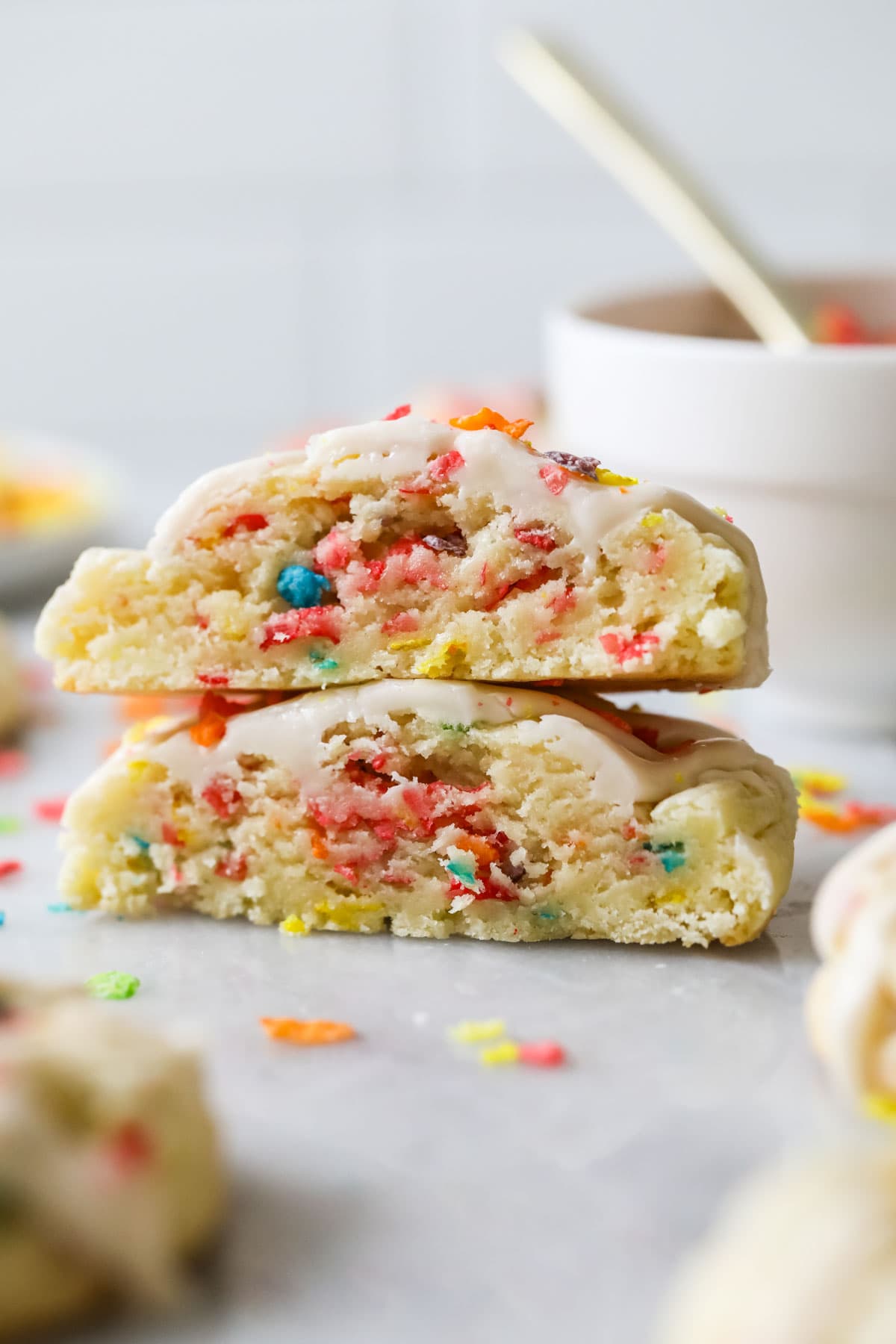 Cross section of a cookie made with Fruity Pebbles cereal.