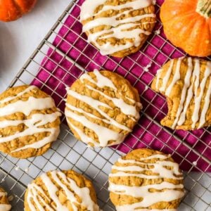 Overhead view of pumpkin oatmeal cookies topped with a brown sugar drizzle.