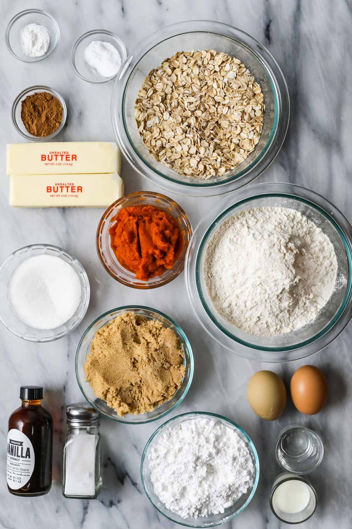 Overhead view of ingredients including oats, pumpkin, brown sugar, and more.