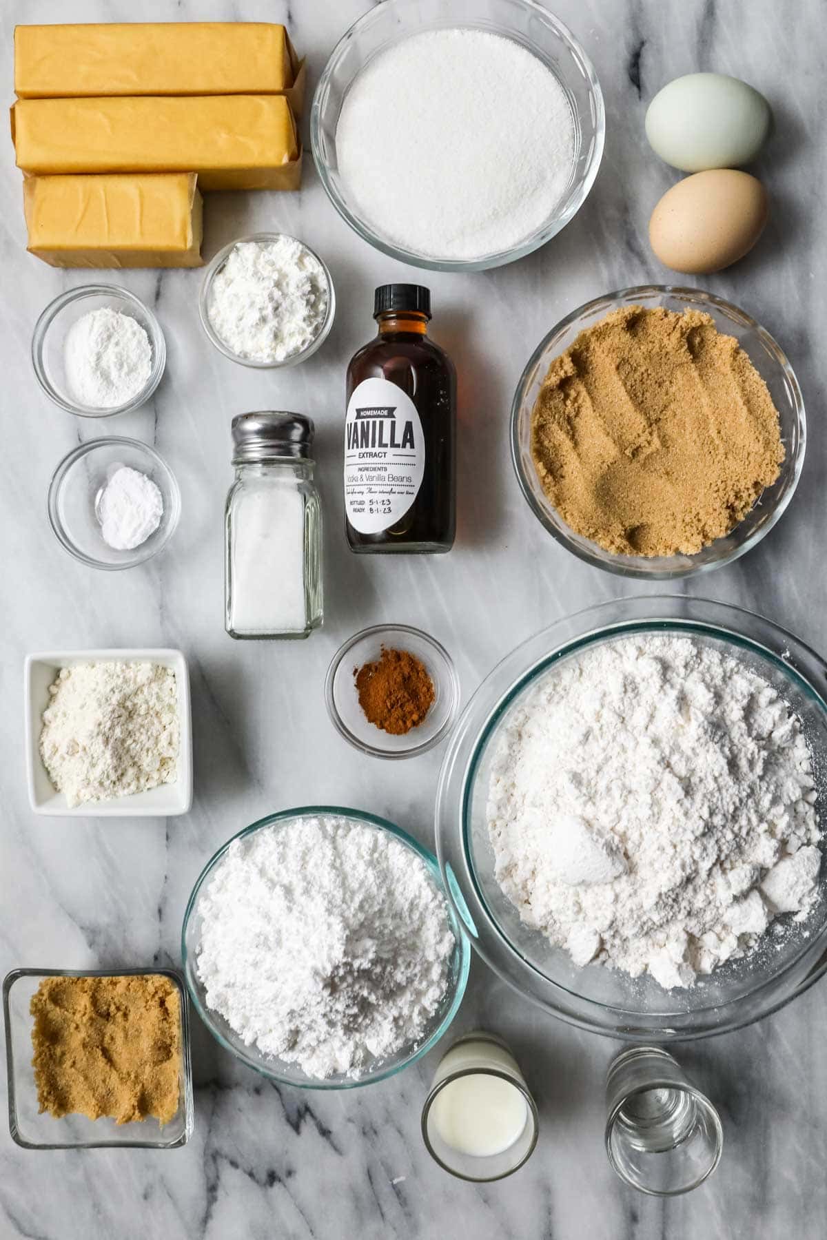 Overhead view of ingredients including brown sugar, cinnamon, butter, and more.