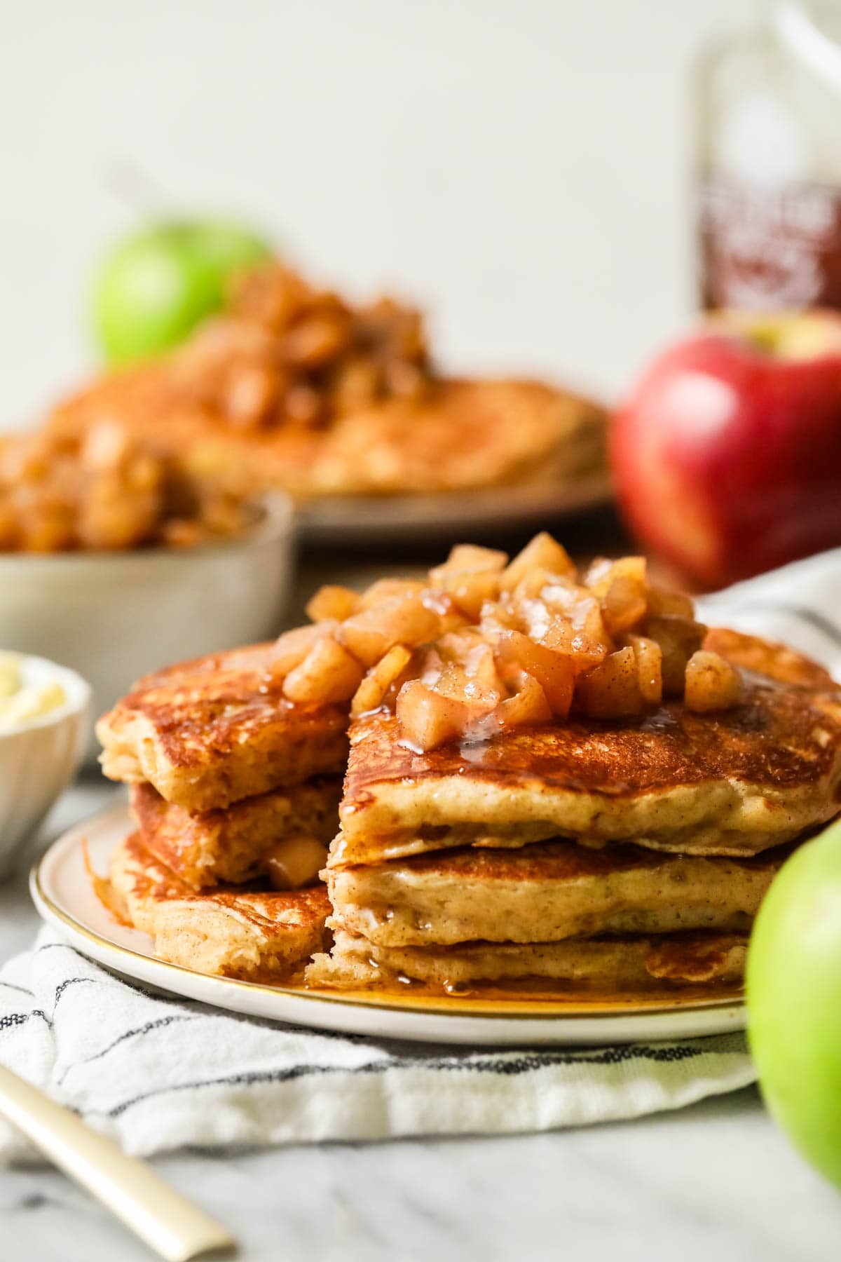 Stack of apple pancakes on a plate