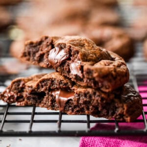 Two chocolate cookie halves stacked on top of each other.