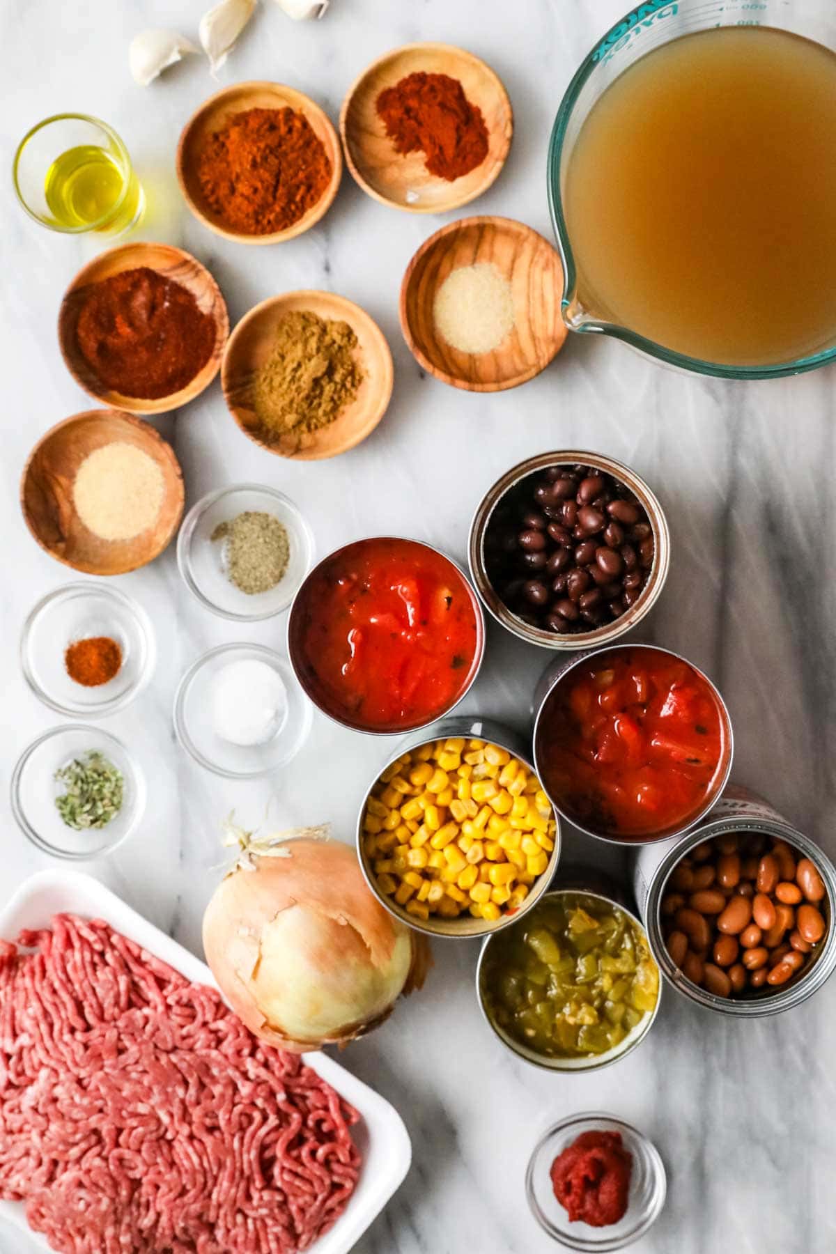 Overhead view of ingredients including corn, beans, ground beef and more.