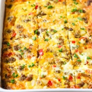 Close-up view of a breakfast casserole that's been cut into squares.